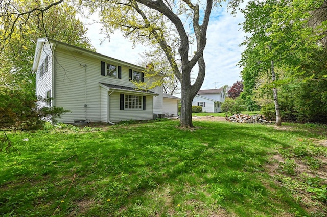 9530 W Debbie Ln, Milwaukee, WI 53224 - back of property featuring central AC unit and a lawn