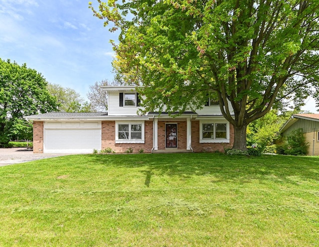 9530 W Debbie Ln, Milwaukee, WI 53224 - view of front facade with brick siding, driveway, and a front yard