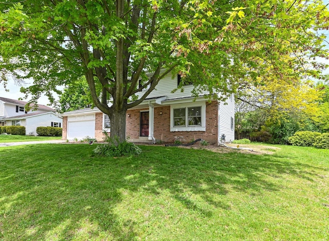 9530 W Debbie Ln, Milwaukee, WI 53224 - obstructed view of property with brick siding, an attached garage, a front yard, and driveway