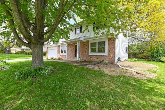 9530 W Debbie Ln, Milwaukee, WI 53224 - view of front of house with an attached garage, brick siding, and a front yard