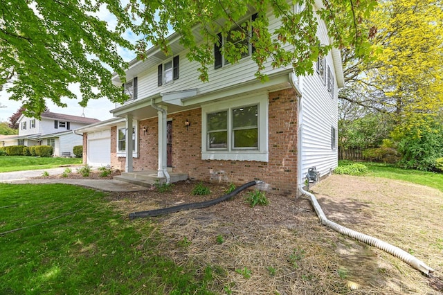 9530 W Debbie Ln, Milwaukee, WI 53224 - traditional home with brick siding, a garage, and a front yard