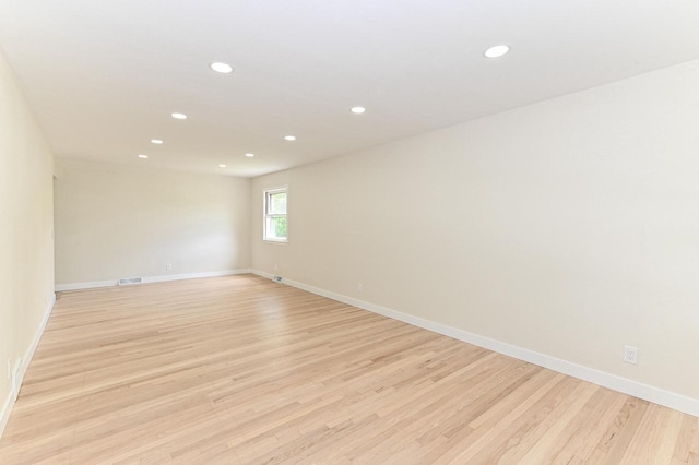 9530 W Debbie Ln, Milwaukee, WI 53224 - empty room featuring recessed lighting, light wood-type flooring, and baseboards
