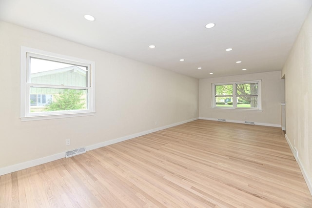 9530 W Debbie Ln, Milwaukee, WI 53224 - empty room featuring light wood-type flooring, recessed lighting, and baseboards