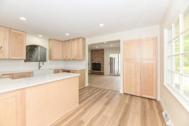 9530 W Debbie Ln, Milwaukee, WI 53224 - kitchen featuring light brown cabinets, a sink, light wood finished floors, and recessed lighting