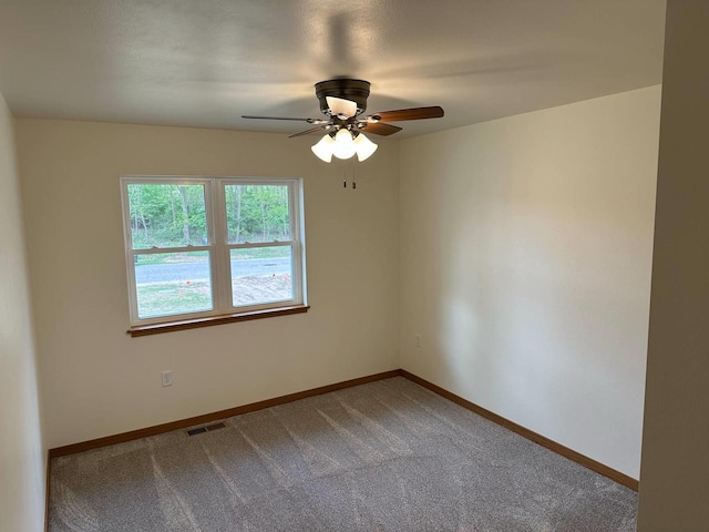 513 Oak Grove Dr, Necedah, WI 54646 - carpeted spare room featuring a ceiling fan and baseboards