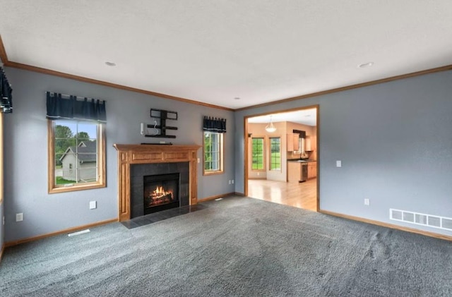 2605 River Ridge Drive, Waukesha, WI 53189 - unfurnished living room featuring baseboards, carpet floors, a fireplace, and crown molding