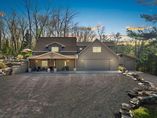 15393 Jacklin Heights Cir, Crivitz, WI 54114 - view of front facade with a garage, covered porch, driveway, and a shingled roof