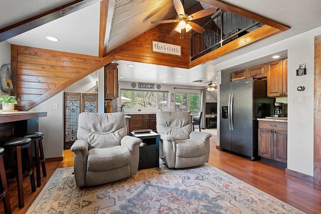 15393 Jacklin Heights Cir, Crivitz, WI 54114 - living area featuring a ceiling fan, wood finished floors, baseboards, and high vaulted ceiling