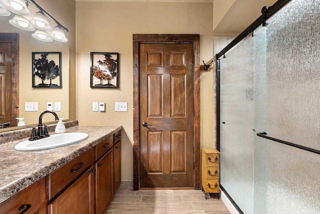 15393 Jacklin Heights Cir, Crivitz, WI 54114 - bathroom featuring a shower stall, vanity, and wood finished floors