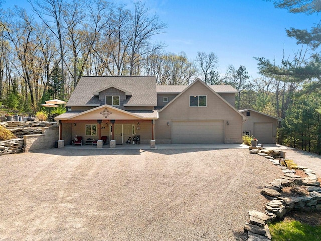 15393 Jacklin Heights Cir, Crivitz, WI 54114 - view of front of home with a garage, driveway, a porch, and roof with shingles