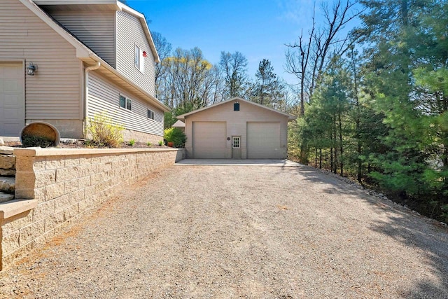 15393 Jacklin Heights Cir, Crivitz, WI 54114 - view of side of home featuring a garage and an outbuilding