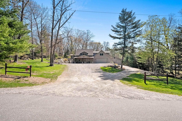 15393 Jacklin Heights Cir, Crivitz, WI 54114 - view of front facade with a garage and dirt driveway