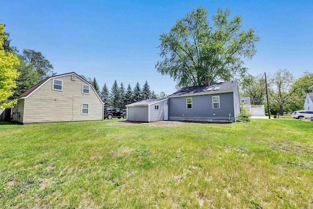 427 Robbins St, Seymour, WI 54165 - back of house with a lawn and a chimney