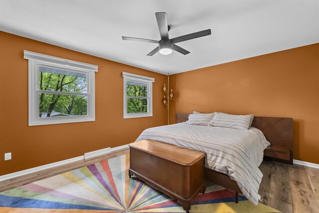522 Valley Rd, Madison, WI 53714 - bedroom with wood finished floors, baseboards, and a ceiling fan