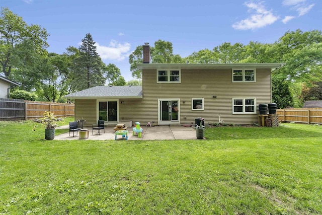 522 Valley Rd, Madison, WI 53714 - back of house featuring a chimney and a patio area