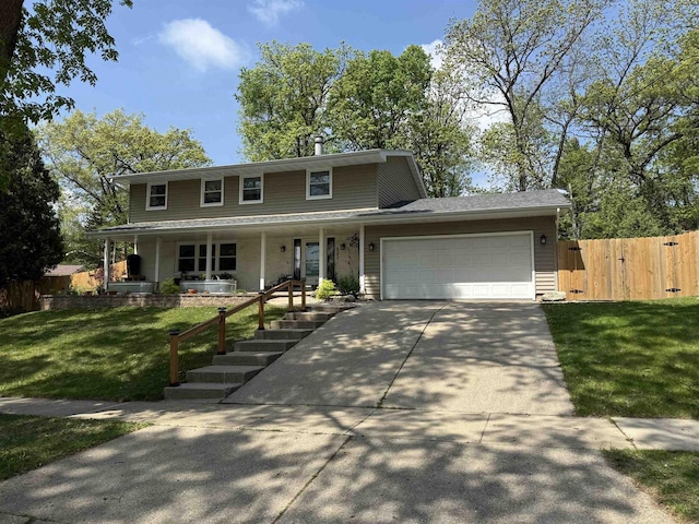 522 Valley Rd, Madison, WI 53714 - view of front of house with covered porch, a garage, and concrete driveway