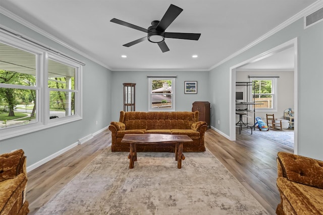 522 Valley Rd, Madison, WI 53714 - living room with wood finished floors, a ceiling fan, baseboards, recessed lighting, and crown molding
