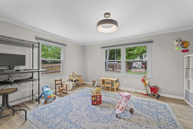 522 Valley Rd, Madison, WI 53714 - game room featuring healthy amount of natural light, wood finished floors, crown molding, and baseboards