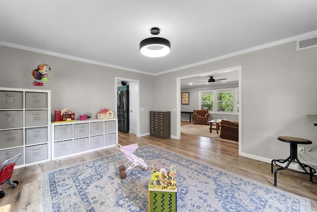 522 Valley Rd, Madison, WI 53714 - game room with ornamental molding, light wood-type flooring, baseboards, and ceiling fan