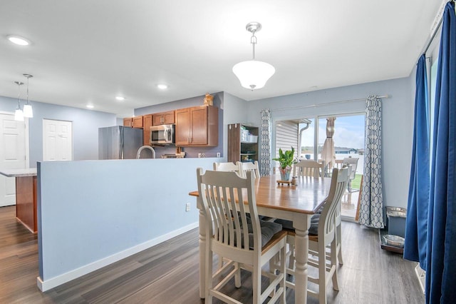 900 Edgewater Dr, Merrill, WI 54452 - dining space featuring dark wood finished floors, recessed lighting, and baseboards