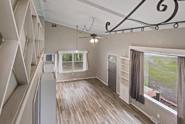 6429 S US Highway 45, Oshkosh, WI 54902 - unfurnished living room featuring lofted ceiling, a ceiling fan, baseboards, and wood finished floors