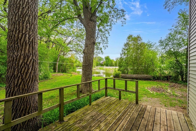 6429 S US Highway 45, Oshkosh, WI 54902 - wooden terrace featuring a water view and a lawn