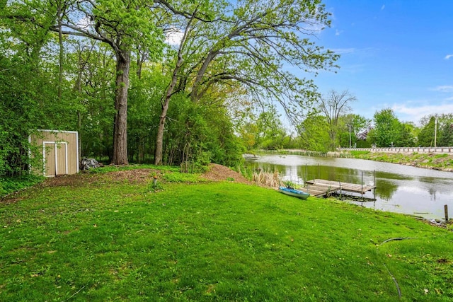 6429 S US Highway 45, Oshkosh, WI 54902 - view of green lawn with a boat dock and a water view