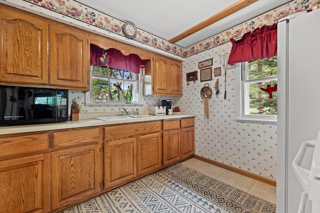 N8991 E Miramar Dr Unit N8993, East Troy, WI 53120 - kitchen featuring black microwave, a sink, wallpapered walls, healthy amount of natural light, and light countertops