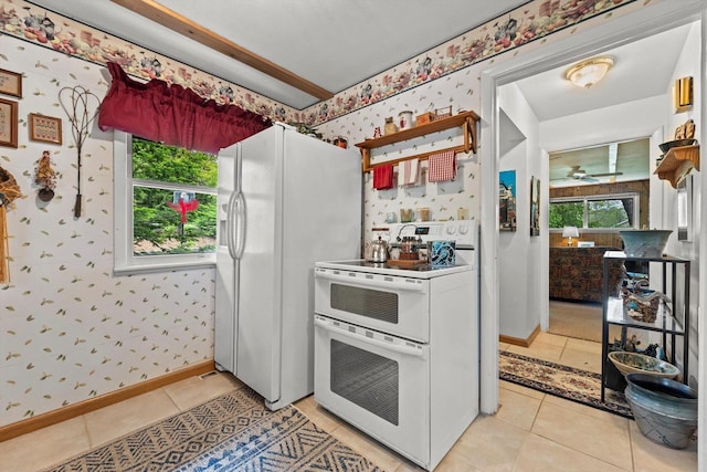 N8991 E Miramar Dr Unit N8993, East Troy, WI 53120 - kitchen with wallpapered walls, white appliances, light tile patterned flooring, baseboards, and a ceiling fan