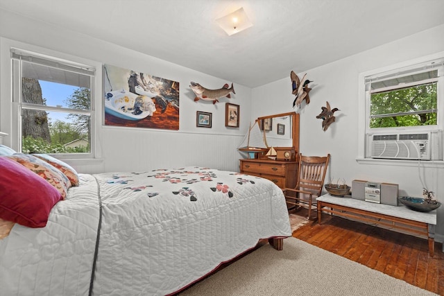 N8991 E Miramar Dr Unit N8993, East Troy, WI 53120 - bedroom featuring hardwood / wood-style floors, wainscoting, and cooling unit