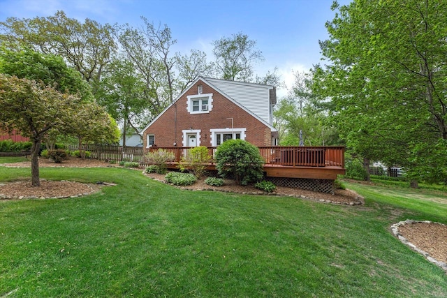 N8991 E Miramar Dr Unit N8993, East Troy, WI 53120 - back of house with a wooden deck, brick siding, and a lawn