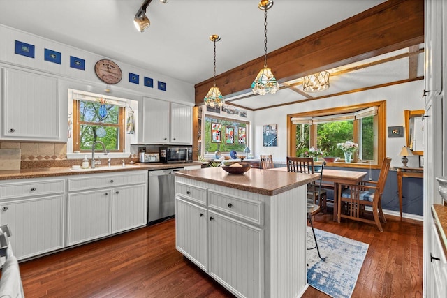 N8991 E Miramar Dr Unit N8993, East Troy, WI 53120 - kitchen with a sink, appliances with stainless steel finishes, white cabinetry, dark wood-style flooring, and a kitchen island