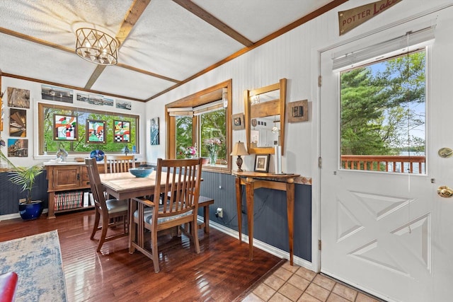 N8991 E Miramar Dr Unit N8993, East Troy, WI 53120 - dining area with plenty of natural light, ornamental molding, light wood-type flooring, beam ceiling, and a textured ceiling
