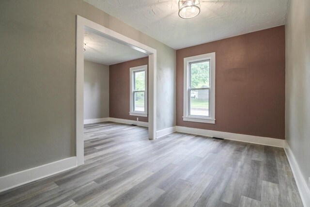 139 S Church St, Whitewater, WI 53190 - empty room featuring wood finished floors and baseboards