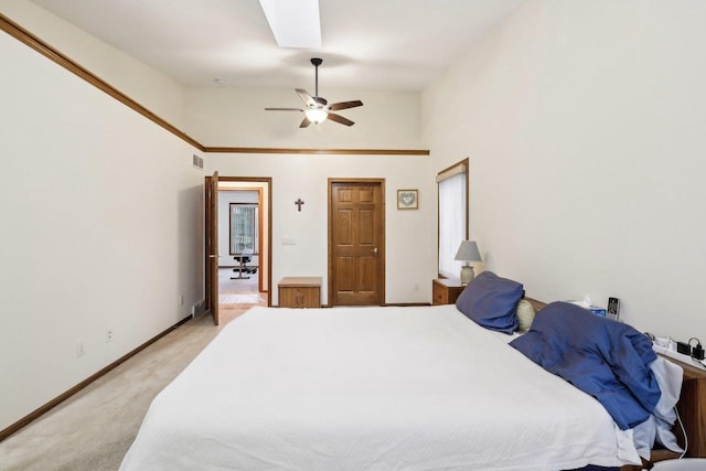 615 Jefferson St, Waterloo, WI 53594 - bedroom with light carpet, ceiling fan, baseboards, a skylight, and lofted ceiling