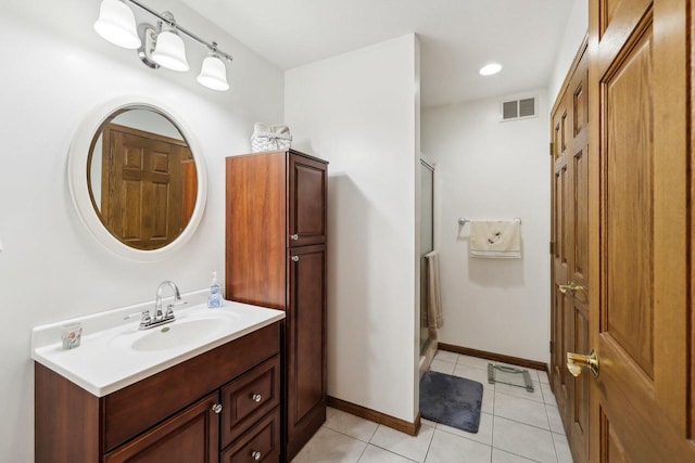 615 Jefferson St, Waterloo, WI 53594 - bathroom featuring vanity, tile patterned flooring, a stall shower, and baseboards
