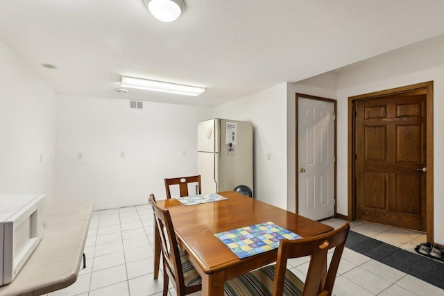615 Jefferson St, Waterloo, WI 53594 - dining space with light tile patterned floors