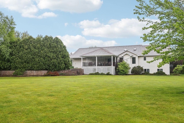 615 Jefferson St, Waterloo, WI 53594 - view of front of house featuring a sunroom and a front lawn