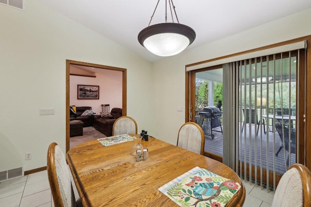 615 Jefferson St, Waterloo, WI 53594 - dining space with light tile patterned floors and vaulted ceiling