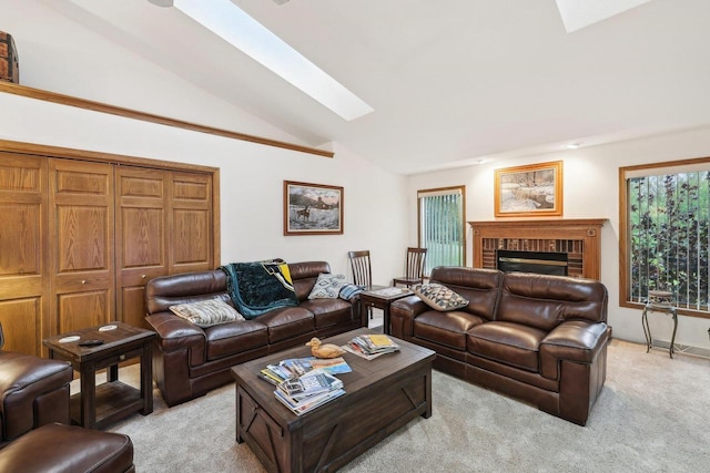 615 Jefferson St, Waterloo, WI 53594 - living area with a skylight, vaulted ceiling, light carpet, and a fireplace