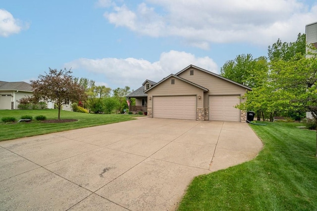 3829 Nicholas Dr, Menomonie, WI 54751 - view of front of house featuring a front lawn, stone siding, driveway, and a garage