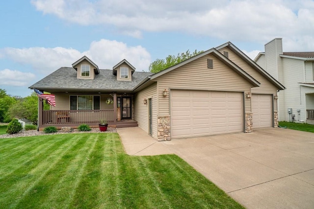 3829 Nicholas Dr, Menomonie, WI 54751 - view of front of home with driveway, an attached garage, a porch, and a front yard