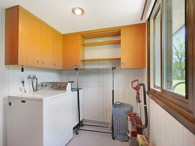 4701 4th St, Kenosha, WI 53144 - laundry room featuring washer / clothes dryer, cabinet space, carpet floors, wooden walls, and healthy amount of natural light