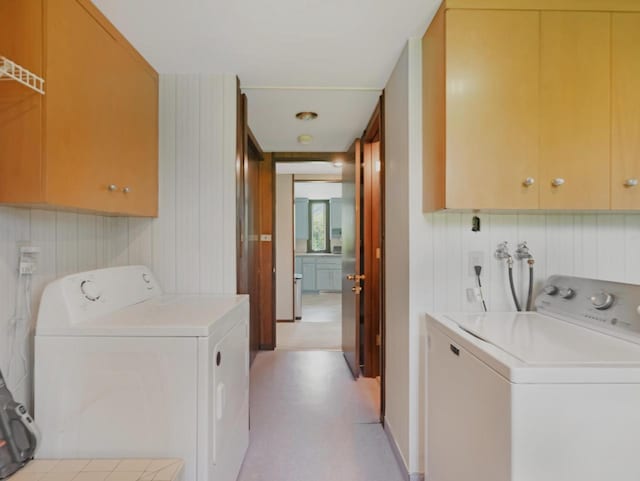4701 4th St, Kenosha, WI 53144 - washroom with cabinet space, independent washer and dryer, and wooden walls