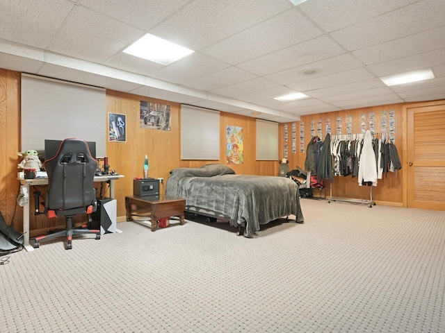 4701 4th St, Kenosha, WI 53144 - carpeted bedroom featuring a drop ceiling, baseboards, and wooden walls