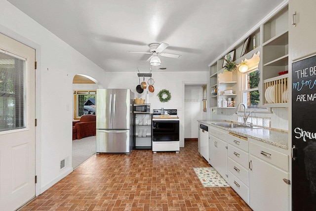 W6023 Lake Dr, Shawano, WI 54166 - kitchen with appliances with stainless steel finishes, a sink, brick patterned flooring, open shelves, and a ceiling fan
