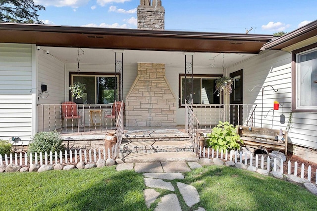 W6023 Lake Dr, Shawano, WI 54166 - property entrance featuring covered porch and a chimney