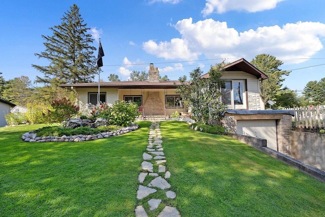 W6023 Lake Dr, Shawano, WI 54166 - view of front of home with stone siding, a chimney, and a garage