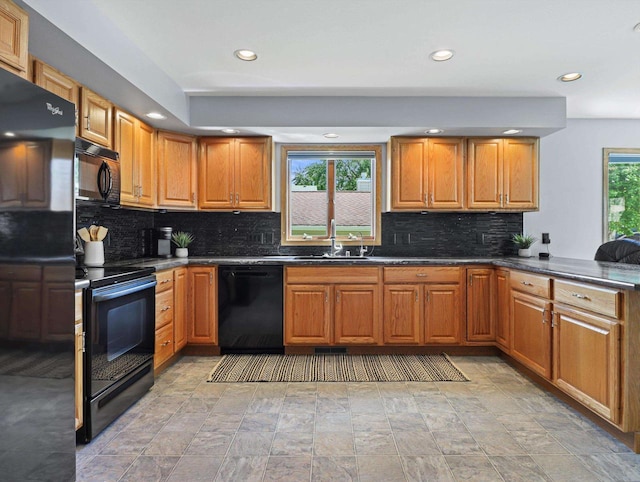 1306 Neponset Trl, Monona, WI 53716 - kitchen with black appliances, a sink, recessed lighting, backsplash, and dark countertops