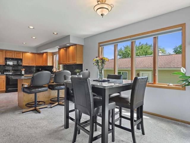 1306 Neponset Trl, Monona, WI 53716 - dining room featuring recessed lighting, light colored carpet, and baseboards
